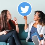 young women showing twitter icon 53876 71137